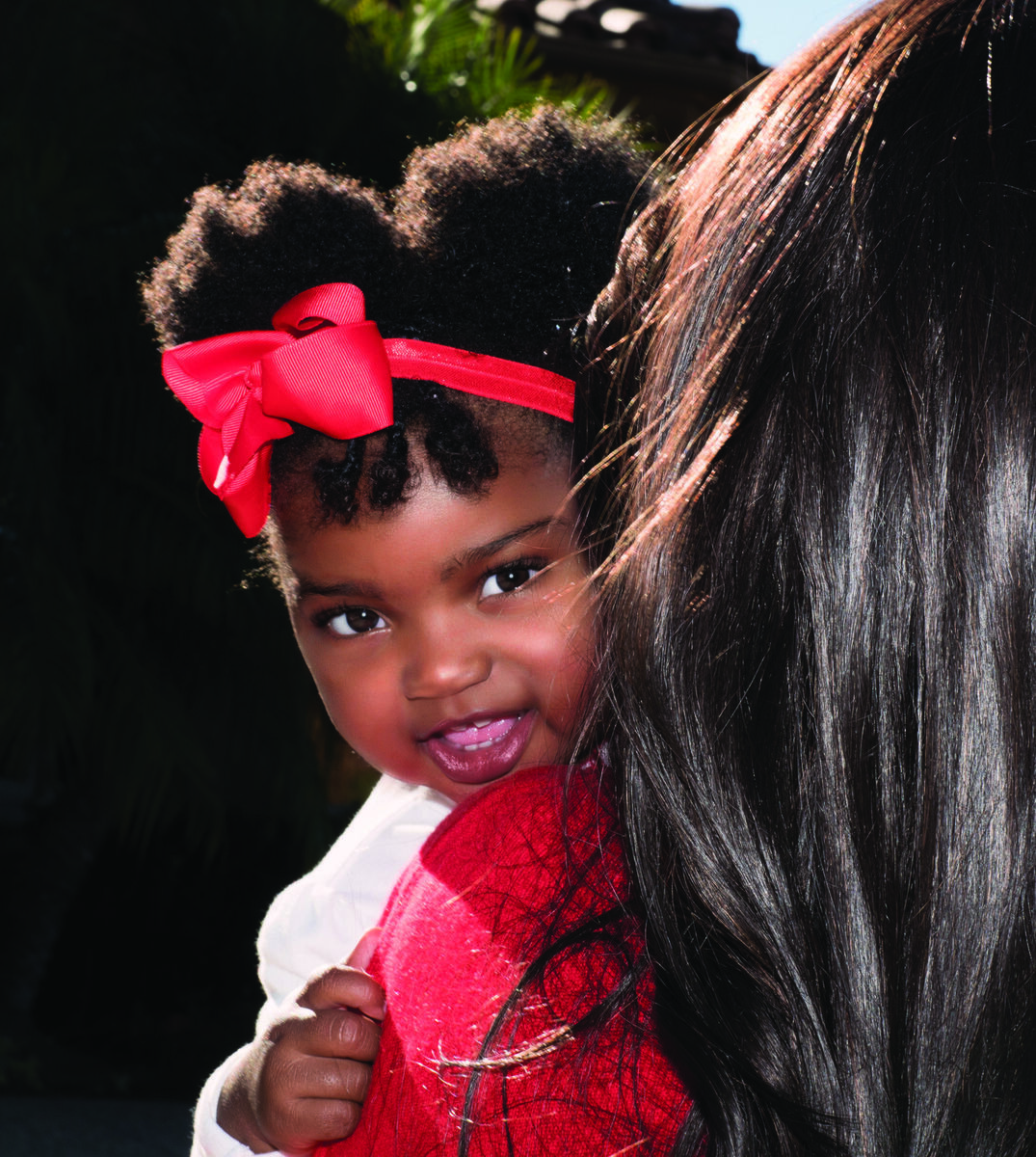 Young child with red bow